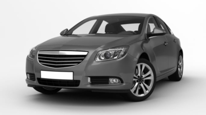 Modern metallic grey sedan vehicle parked against a studio background