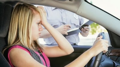 Teenage Girl Receiving a Ticket