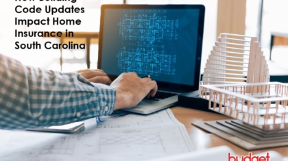 Architect viewing architectural blueprints on a laptop screen next to physical building scale models