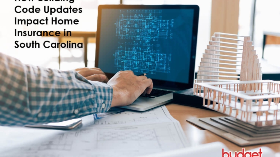 Architect viewing architectural blueprints on a laptop screen next to physical building scale models